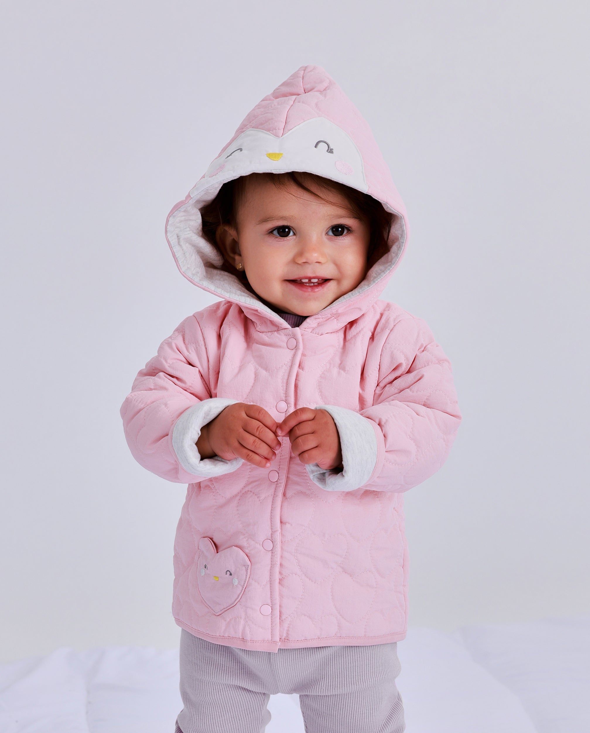 Quilted jacket for newborn in pink with decorated hood
