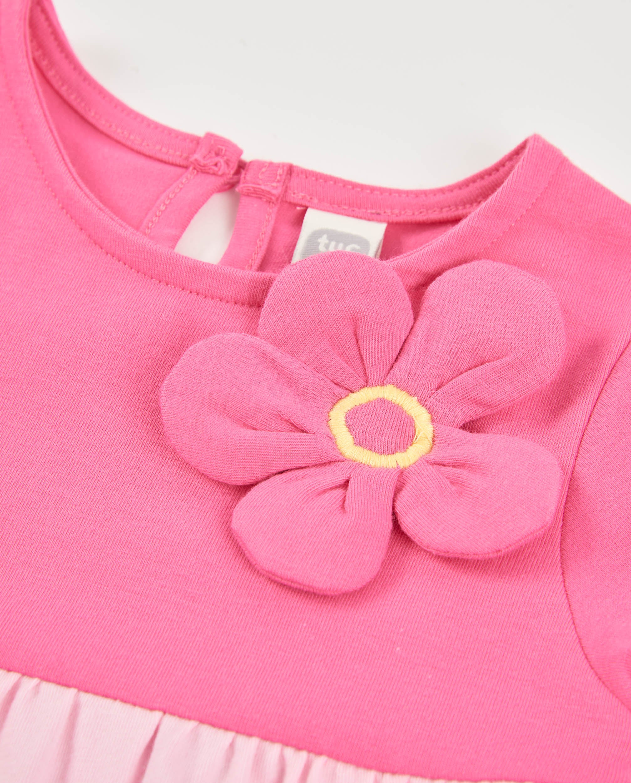 Vestido de niña de punto y flor aplicada