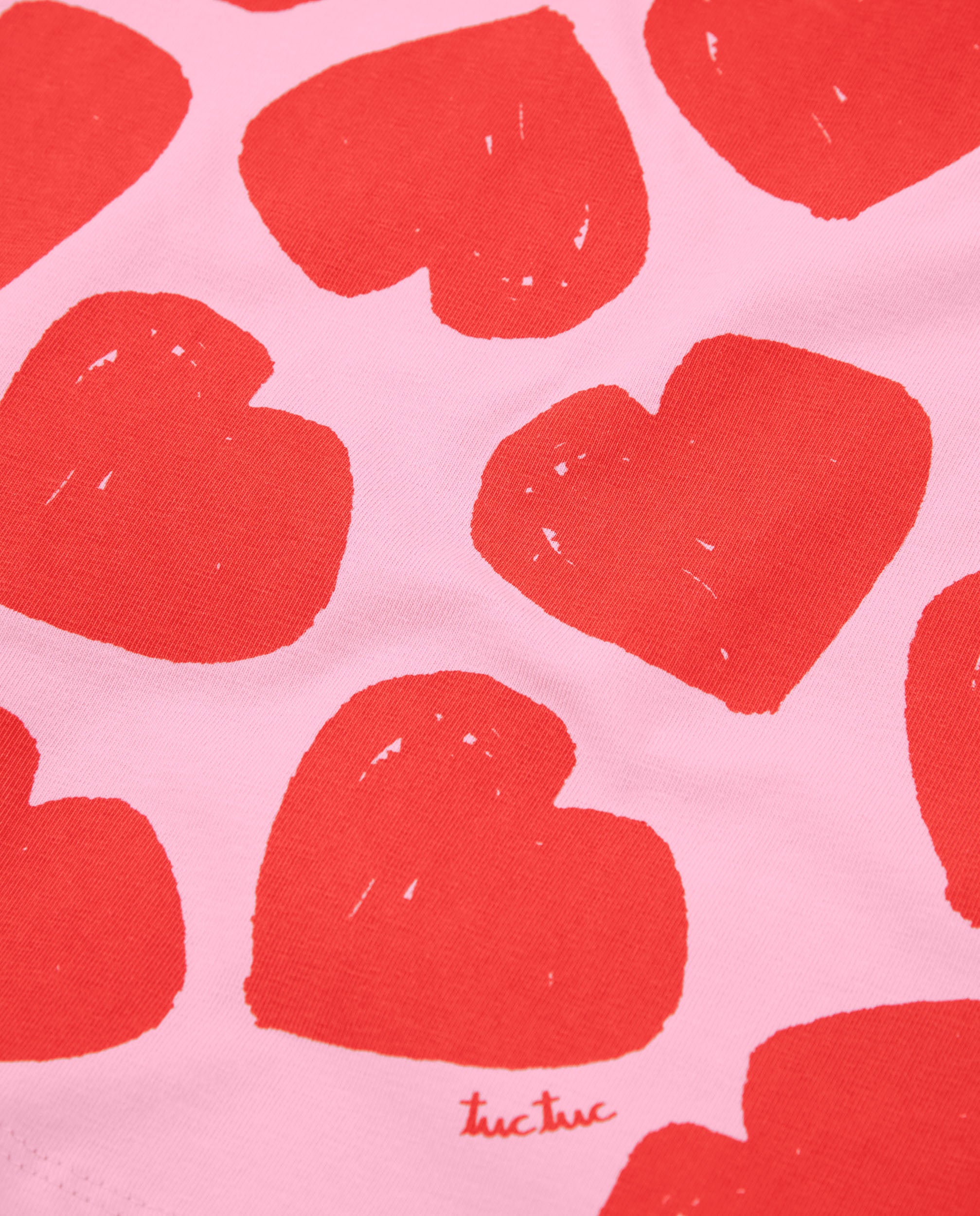 Camiseta de niña de punto y estampado corazones