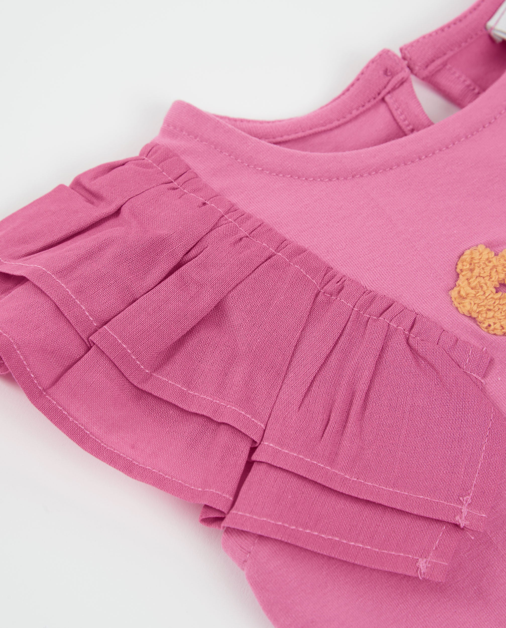 Camiseta de niña de punto con volante lateral