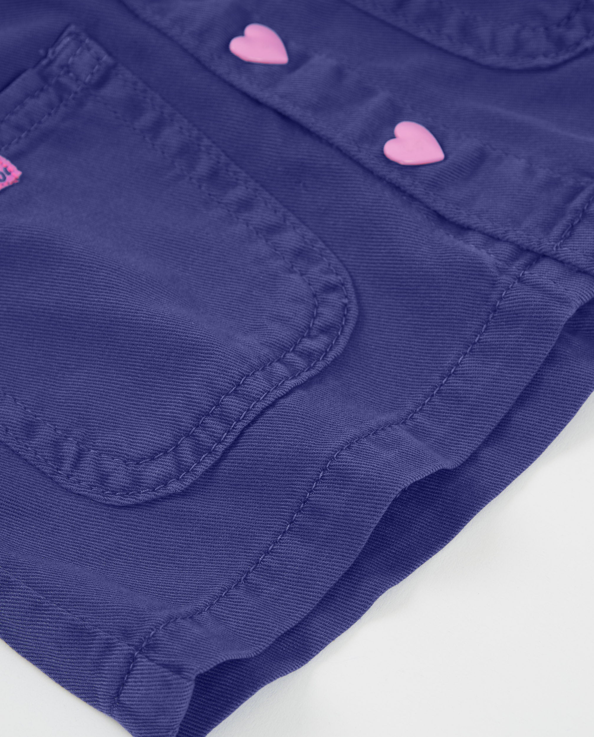 Falda de niña de plana y botones de corazón
