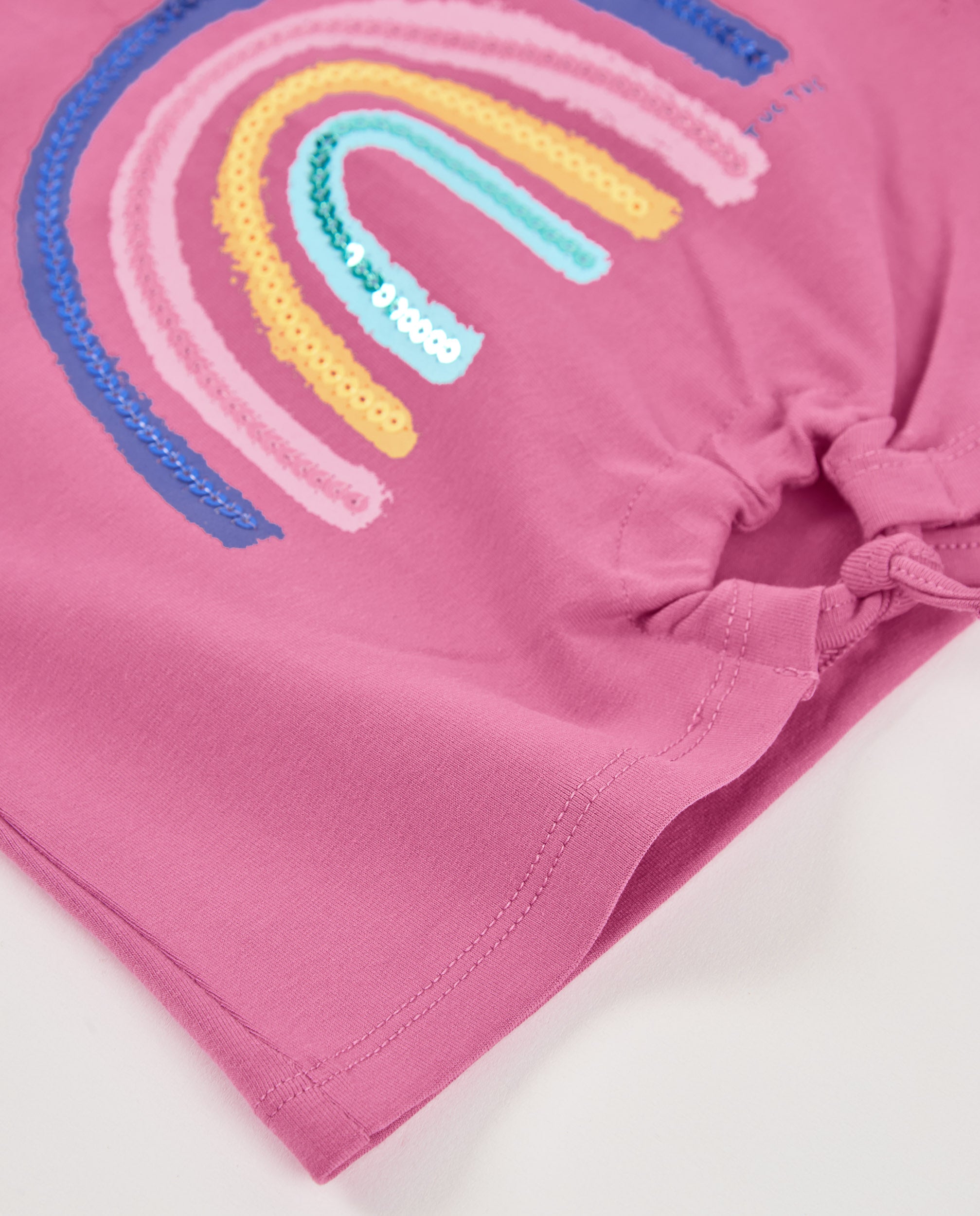 Camiseta de niña de punto y arcoíris con lentejuelas