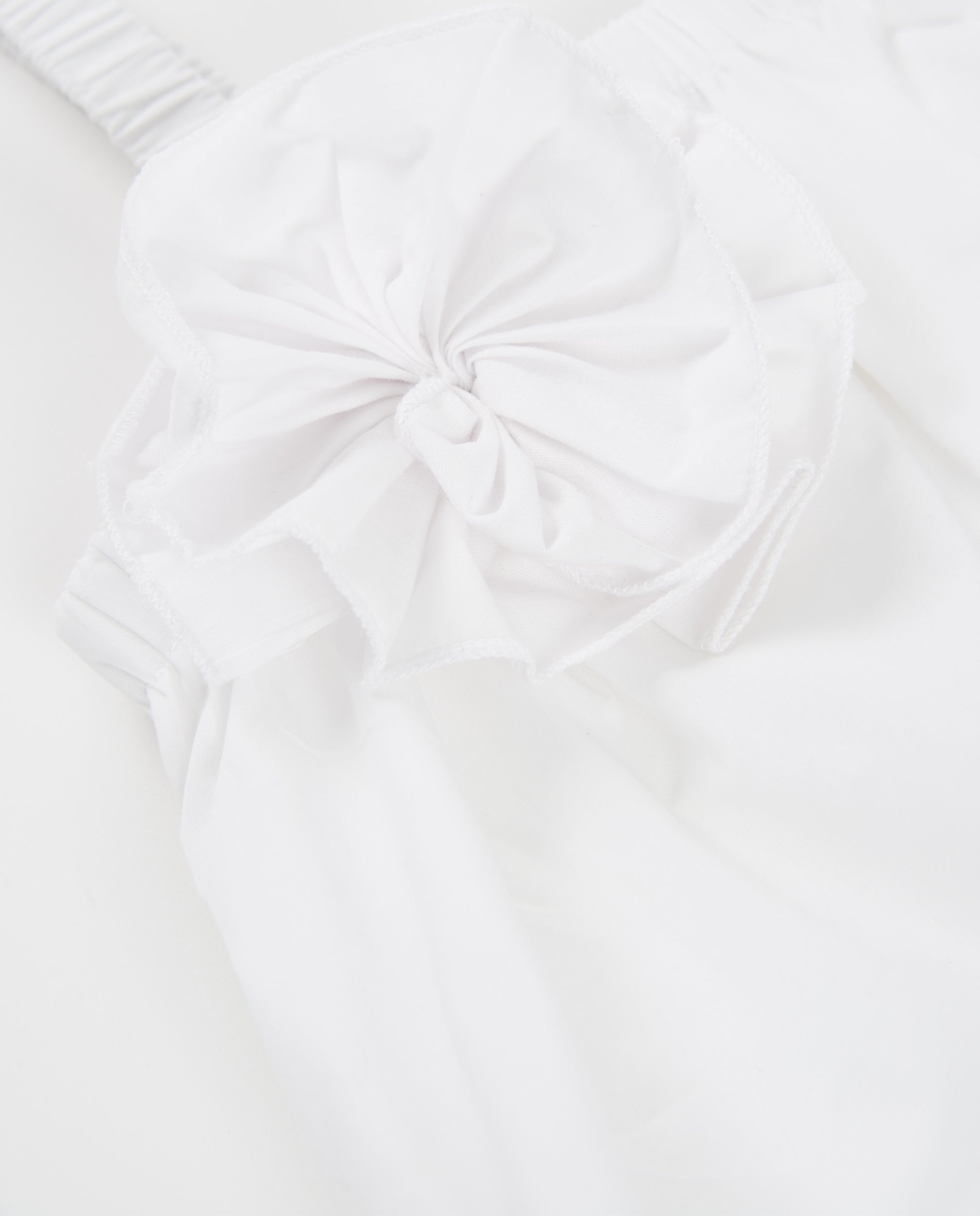 Blusa de niña de plana con aplique de flor
