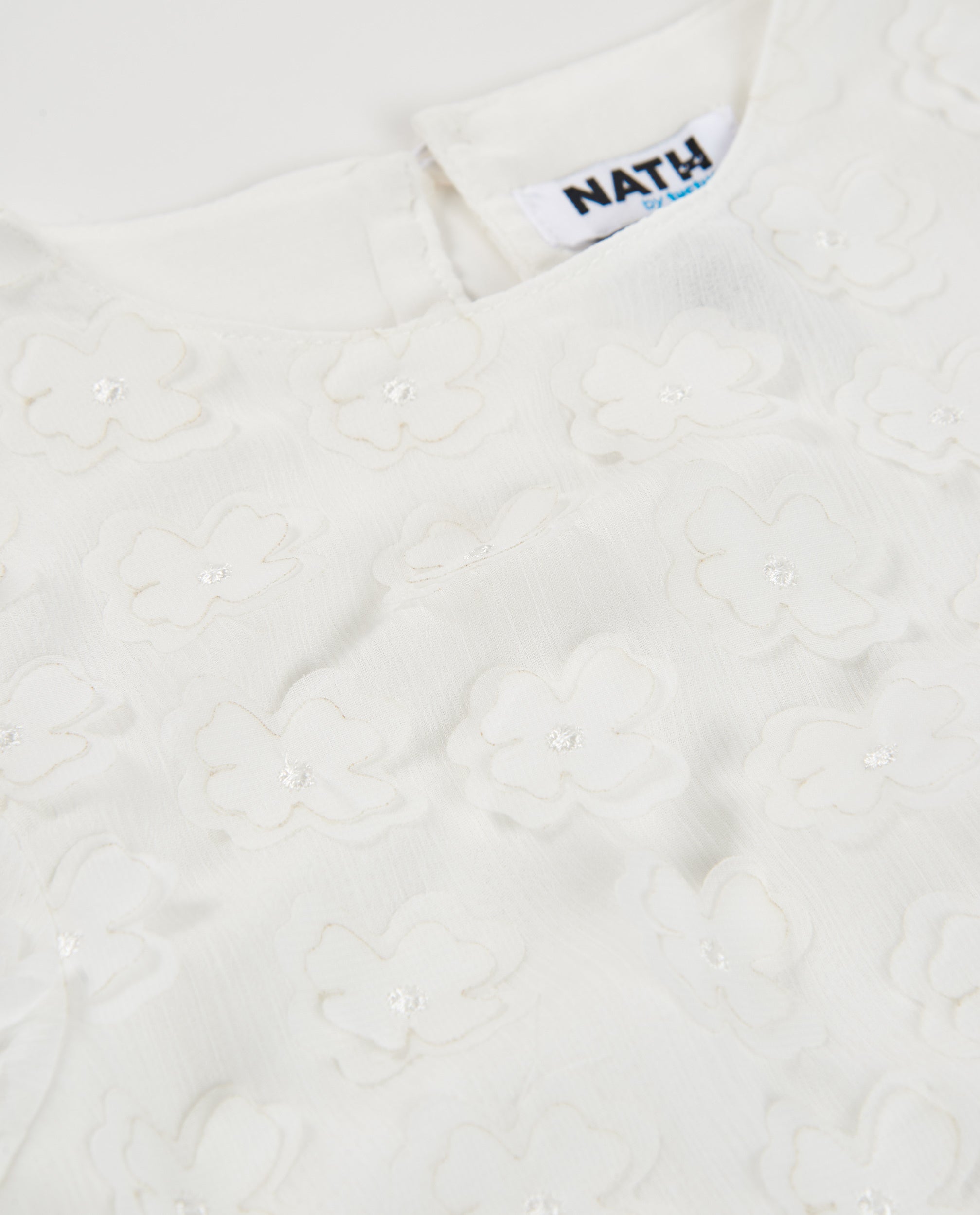 Blusa de niña de plana con aplicaciones florales
