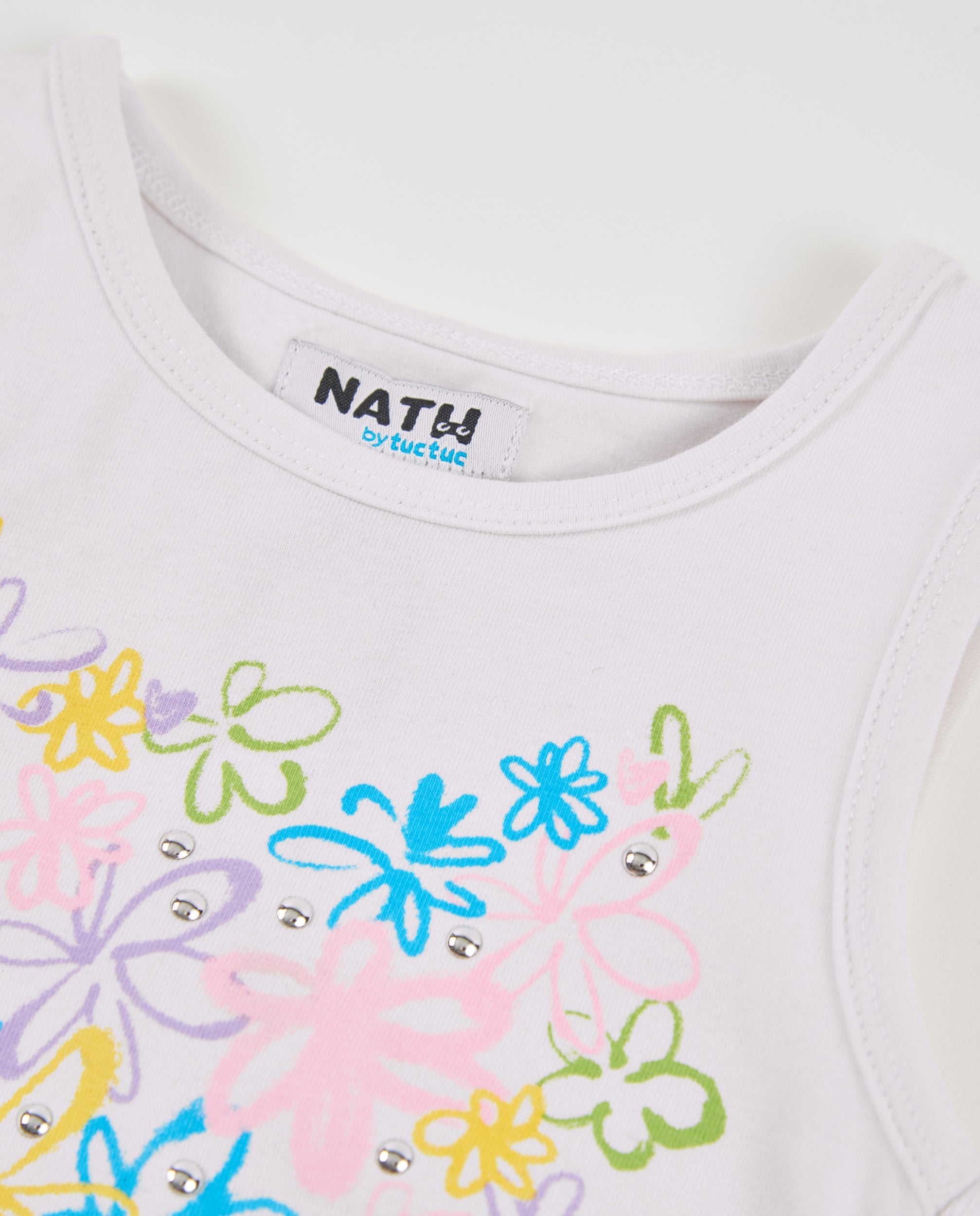 Camiseta de niña de punto con bajo acabado en pico