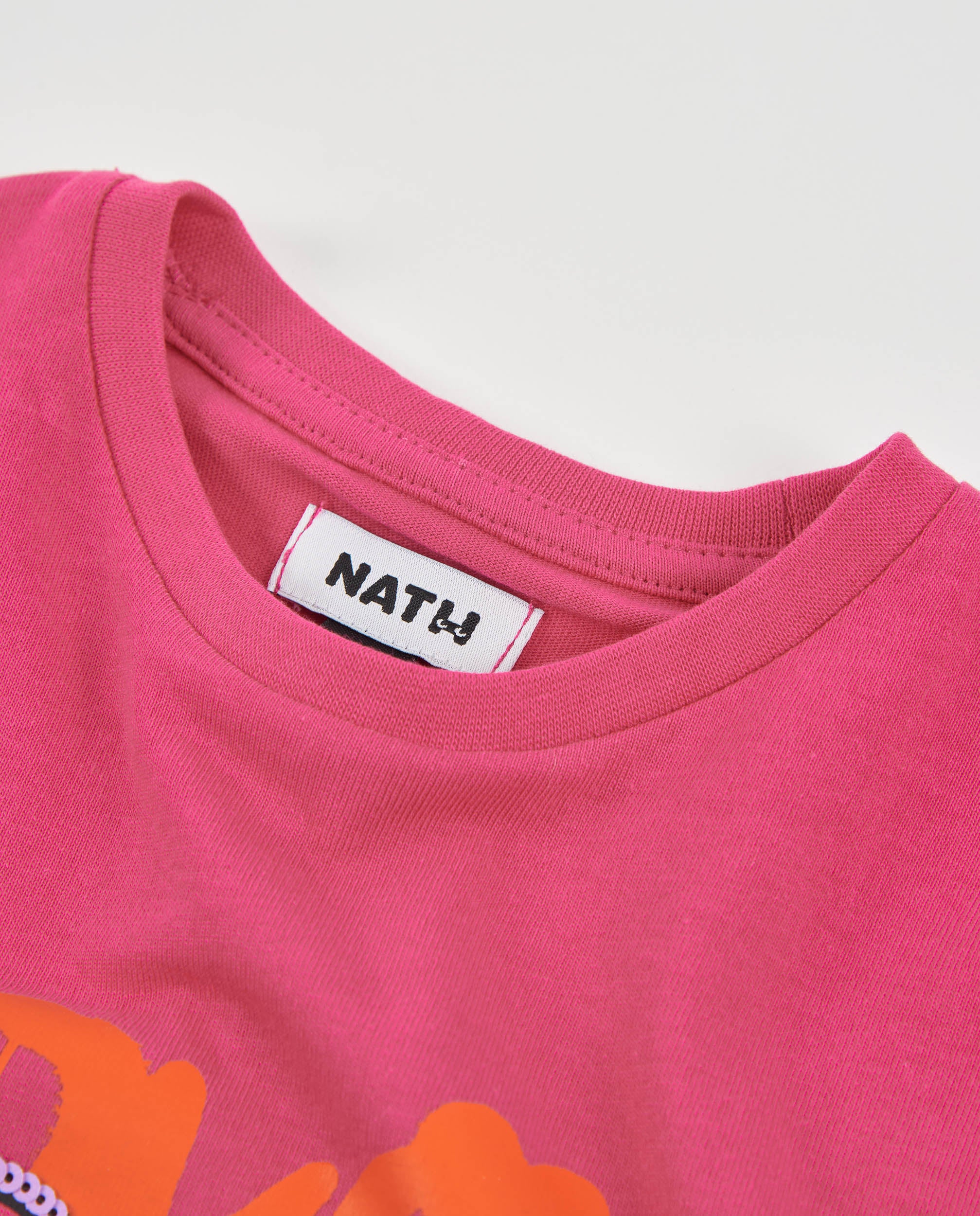 Camiseta de niña de punto con estampado de osito y lentejuelas