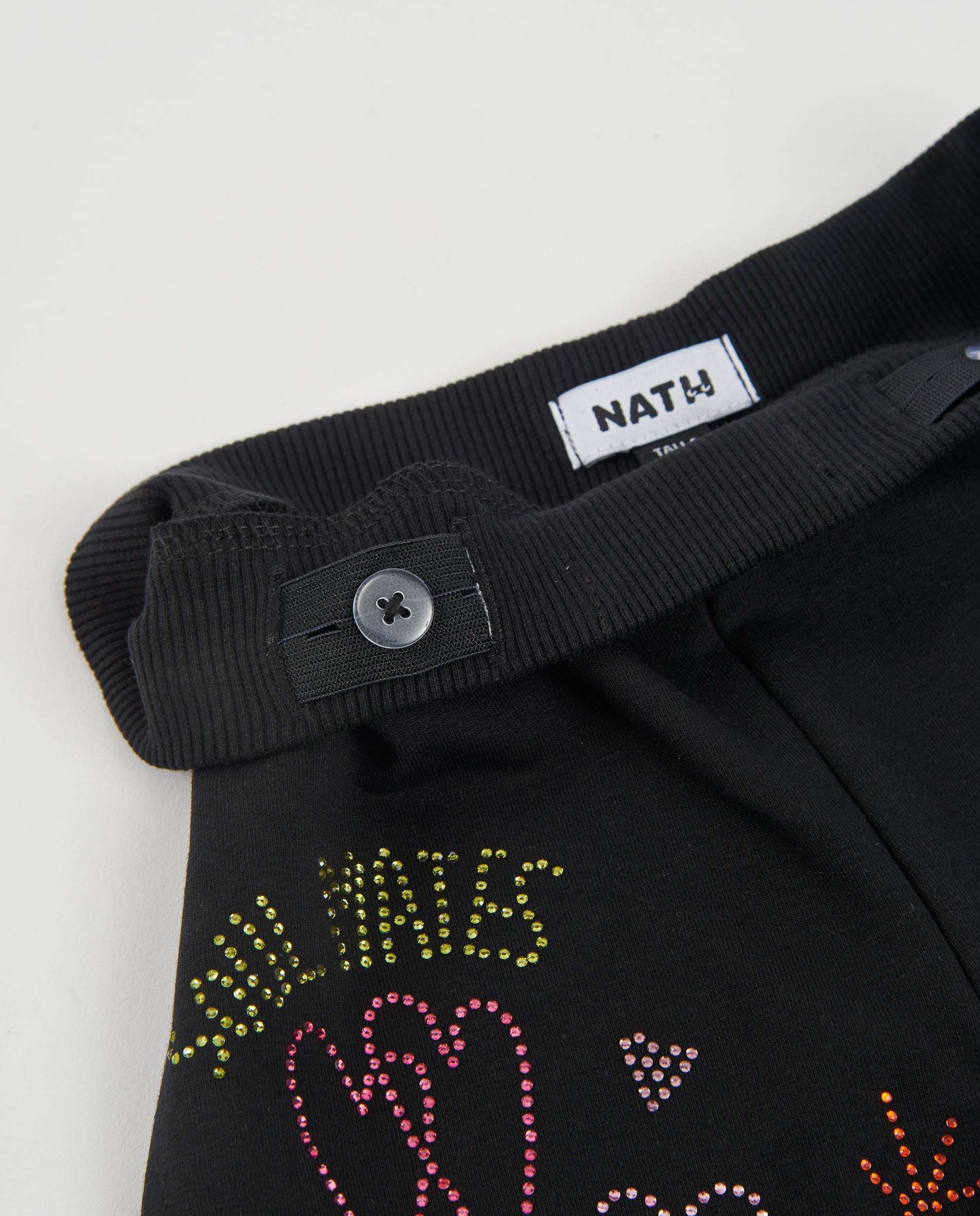 Pantalón de niña de felpa con pierna ancha y detalles florales