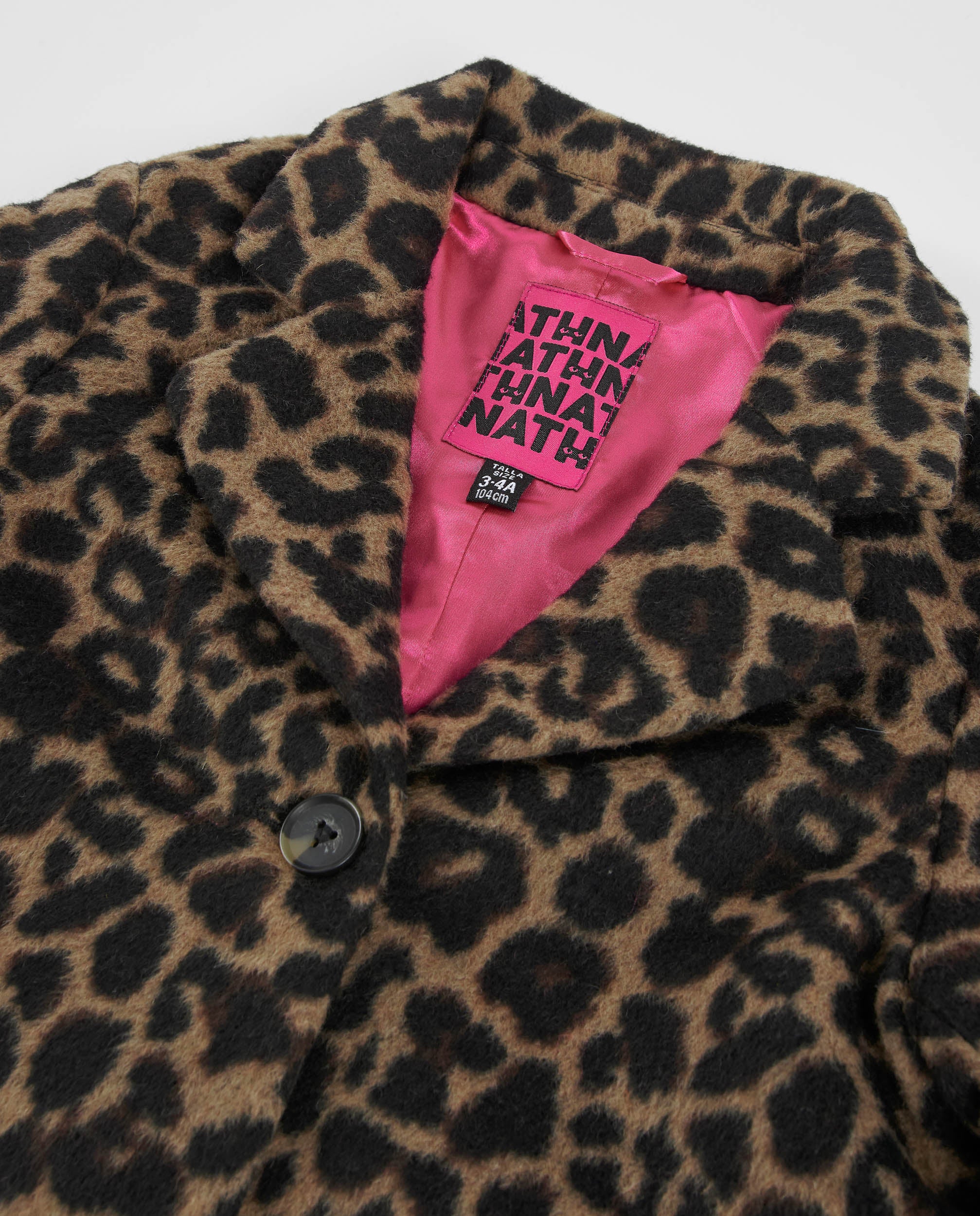 Abrigo de niña de tela plana con estampado animal print y botones