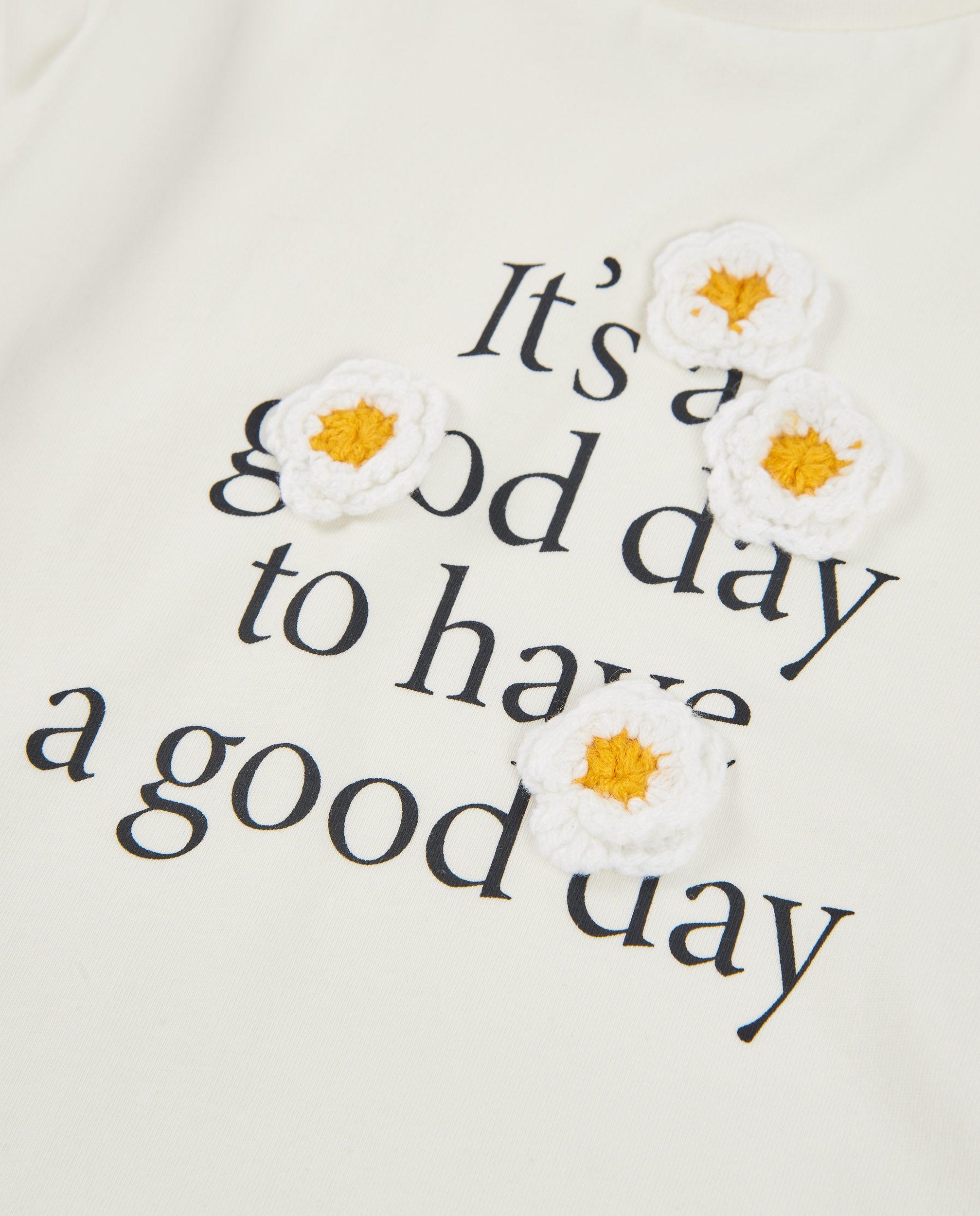 Camiseta de niña de punto con estampado floral y mensaje inspirador
