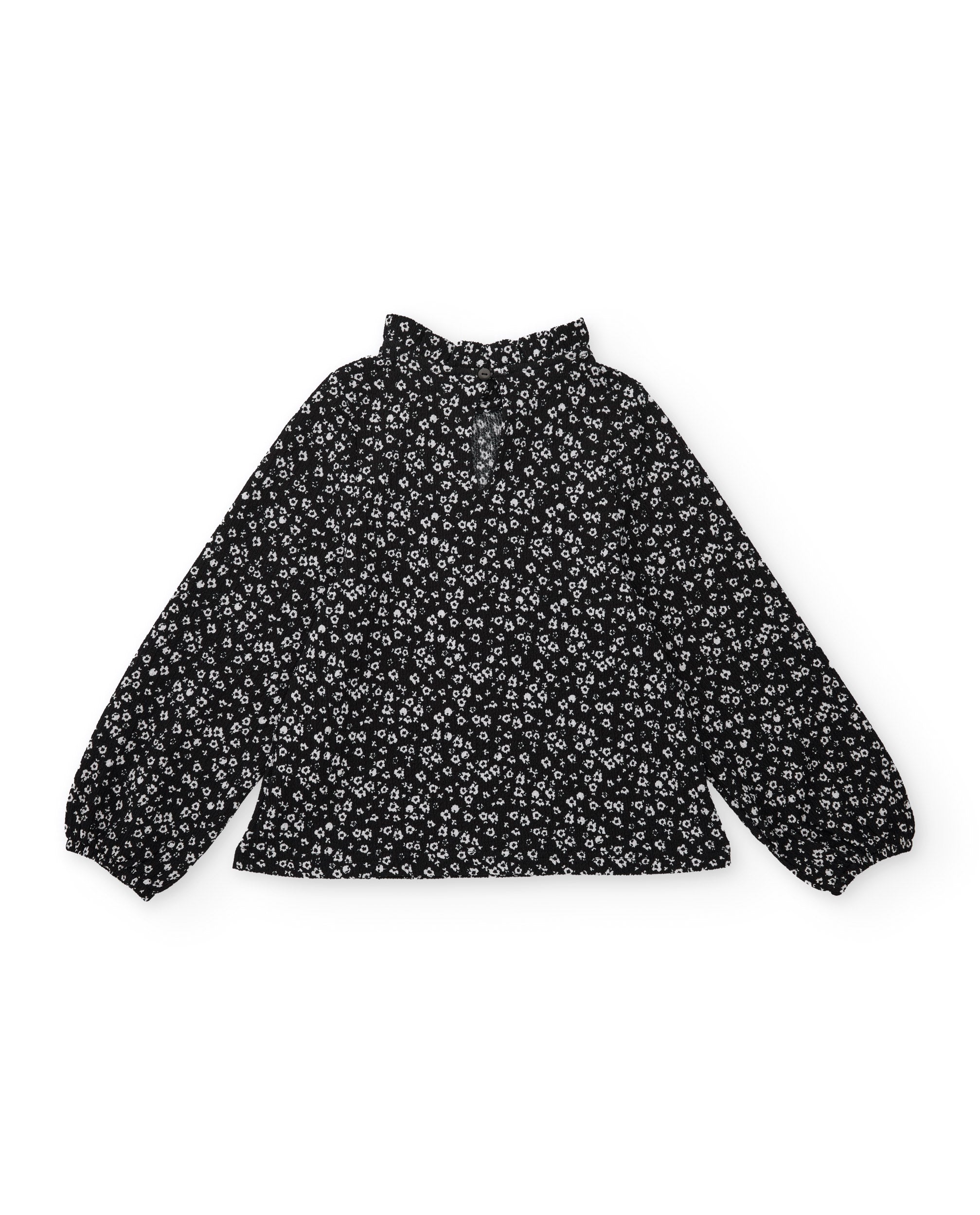 Blusa de niña de tela plana con cuello alto y estampado floral