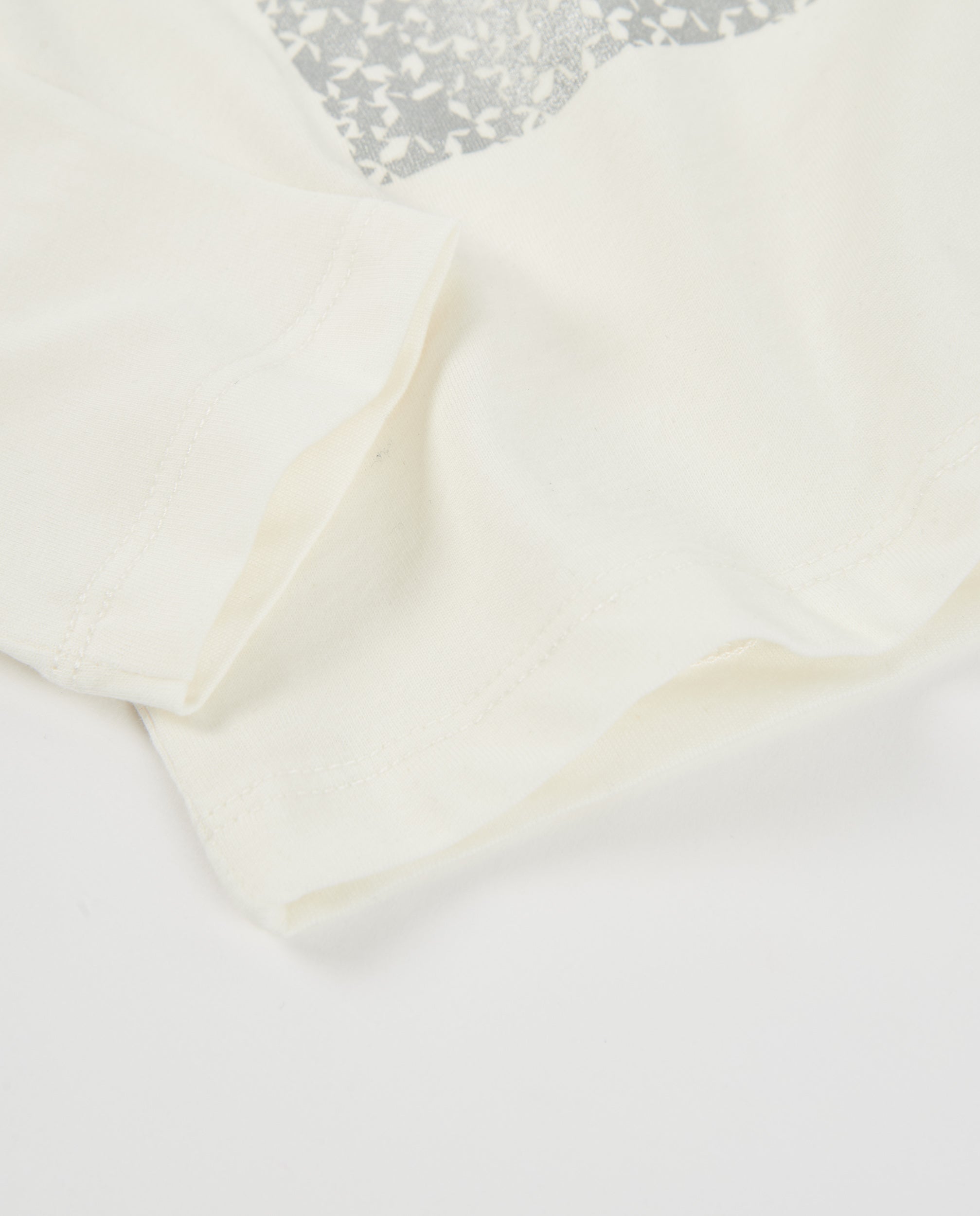 Camiseta de niña de punto con manga larga y detalle de estrellas