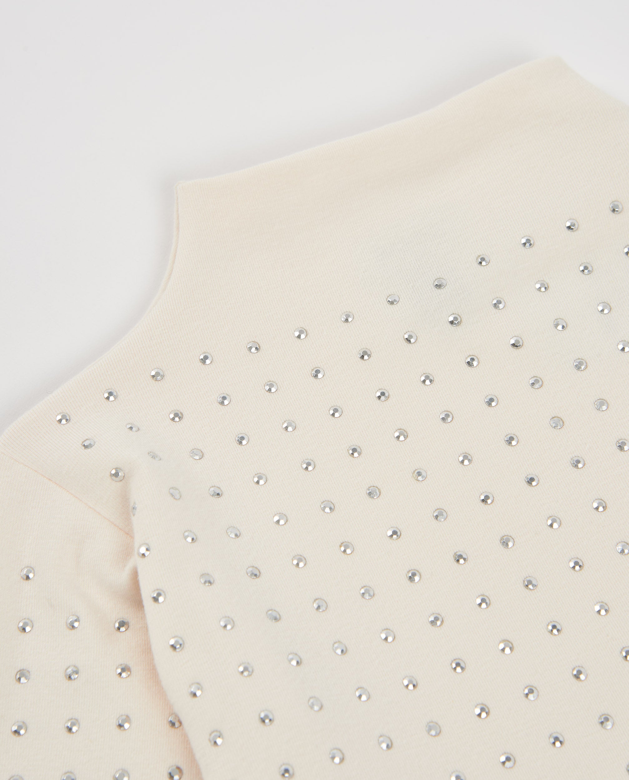 Camiseta de niña de punto con aplicaciones brillantes y cuello alto