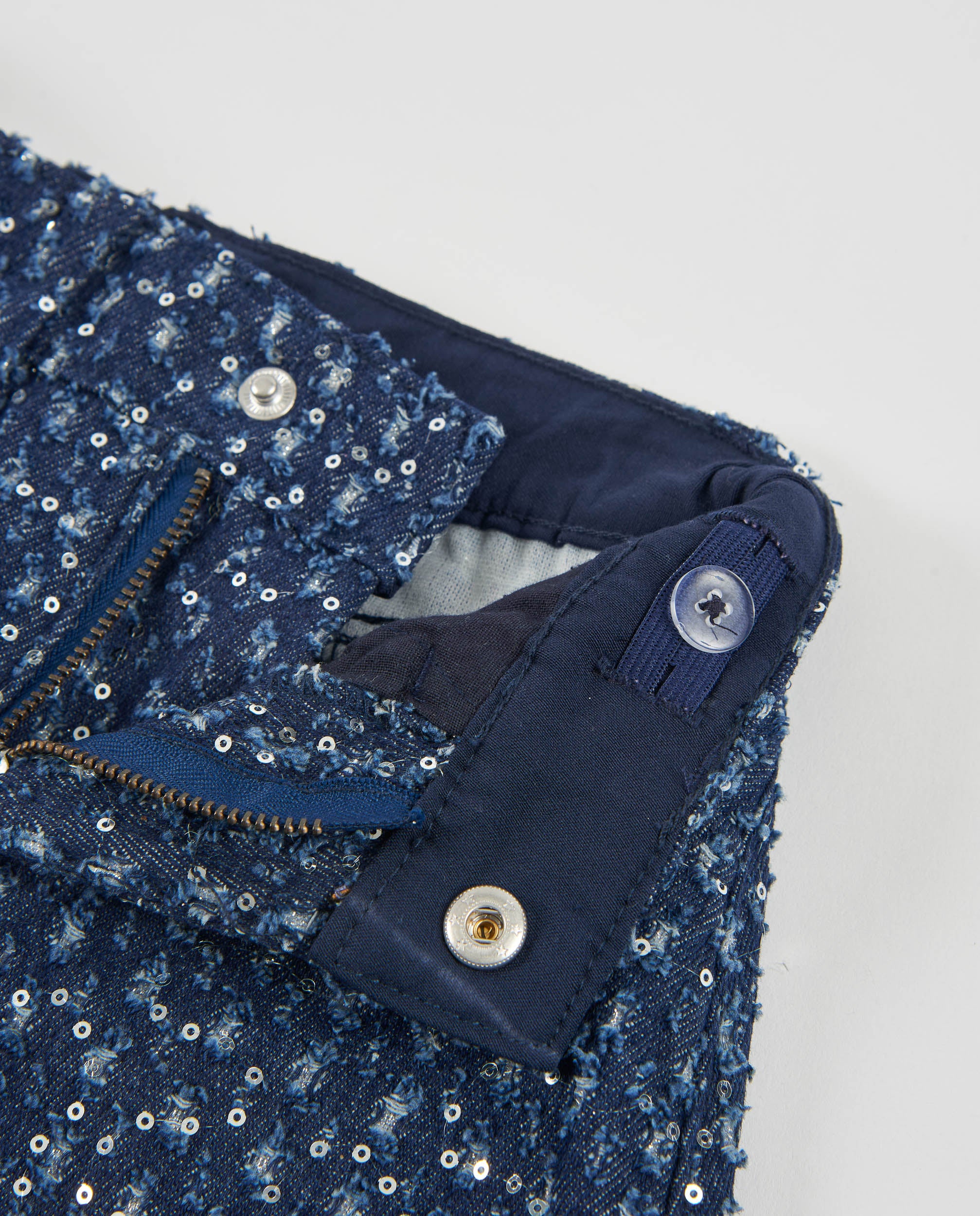 Falda de niña de denim con lentejuelas y corte mini