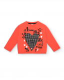 Red T-shirt with a checkered heart and the message "Hugs & Love" for girls from the Cartoon Calling Red T-shirt with a checkered heart and the message "Hugs & Love" for girls from the Cartoon Calling
