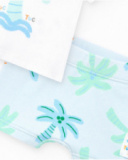 Boys' swim outfit with white palm tree T-shirt and blue tropical print shorts