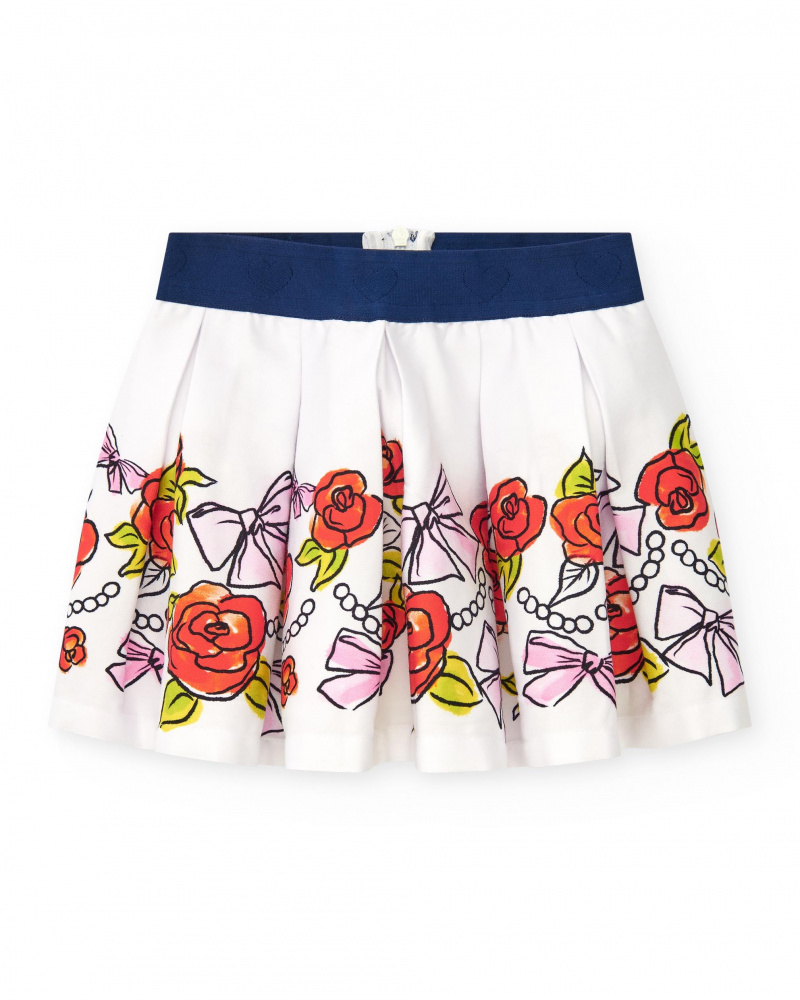 White skirt for girls with floral print and navy blue elastic waistband