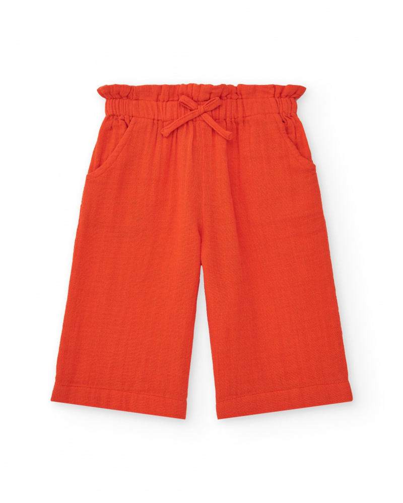 Orange culotte pants for girls with ruched waist and bow