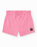 Girls' outfit with white T-shirt and pink shorts with bow