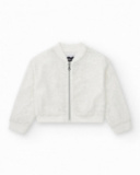 Girls' jacket in white with sequins and a front zipper closure.