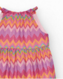 Dress for girls with a multicolor print and adjustable straps.