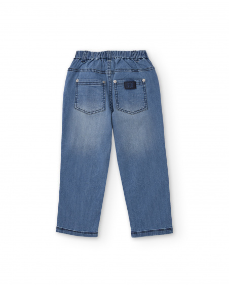 Pantalón vaquero para niño en azul con estampado de palmeras
