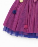 Tulle skirt for girls in fuchsia with multicolor button appliqués.
