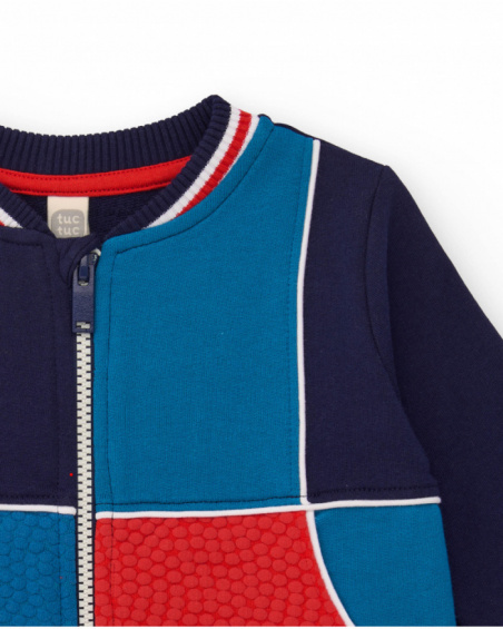 Navy blue fleece jacket for boys with red and blue details.