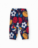 Fleece pants for boys in navy blue with multicolor sports print.