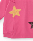 Pink knit dress for girl with star appliqués and shoulder ruffles.