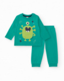 Boys' green knit pajamas with a fun monster print.