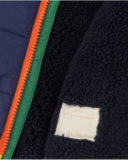 Boys' padded jacket in color blocks of green, navy blue, and orange.
