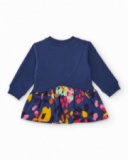 Girls' navy blue knit dress with flower appliqué and printed skirt.