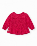 Girls' fuchsia blouse with smocking (honeycomb) detail.