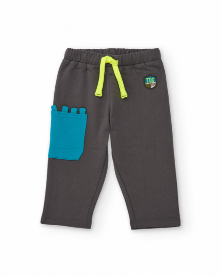 Long fleece trousers for boy in grey with decorative blue pocket
