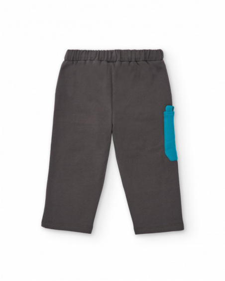 Long fleece trousers for boy in grey with decorative blue pocket