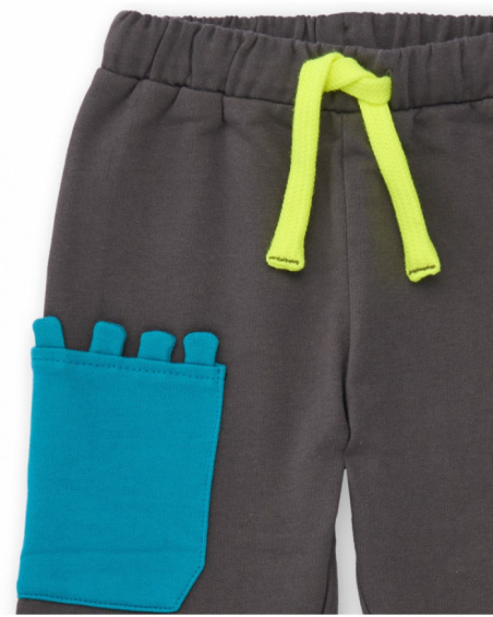 Long fleece trousers for boy in grey with decorative blue pocket