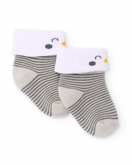 Knit socks for newborn in gray stripes with white cuff and penguin detail