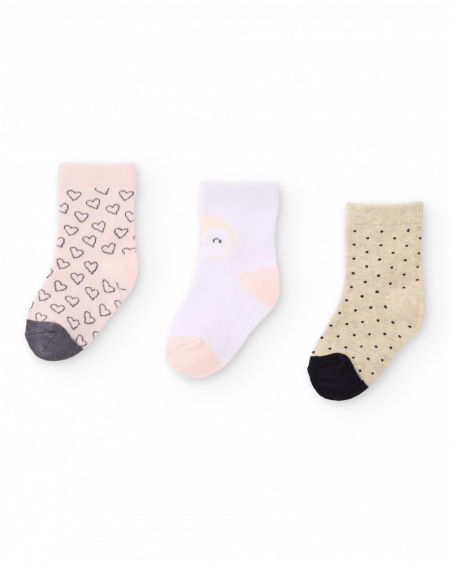 "Set of three pairs of socks for newborn in beige, white, and pink tones with assorted prints."