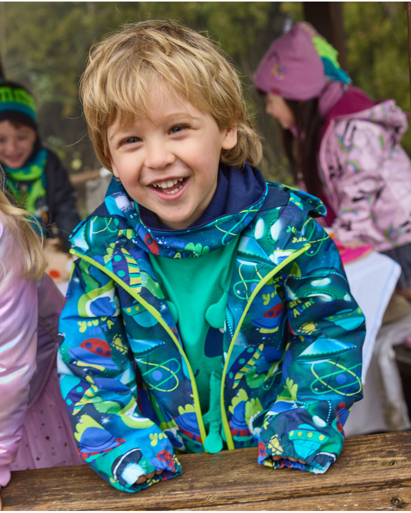 Boys' waterproof jacket with vibrant spaceship print.