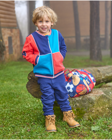 Navy blue fleece jacket for boys with red and blue details.