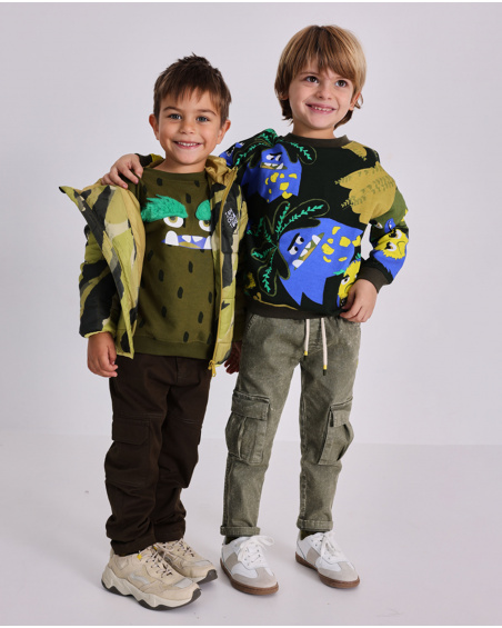 Boys' cargo pants in olive green with a washed effect.