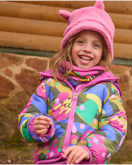 Reversible quilted jacket for girls with multicolor print and hood