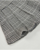 Girl’s checked skirt with pleated design