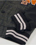 Boys’ varsity jacket with checkered body and black sleeves