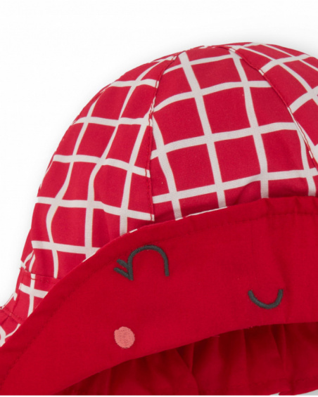 Red knitted hat for girls with white checks and embroidered face