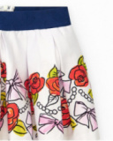 White skirt for girls with floral print and navy blue elastic waistband