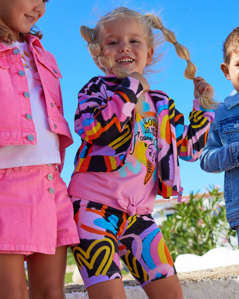 Black jacket for girls with multicolor print and front zipper