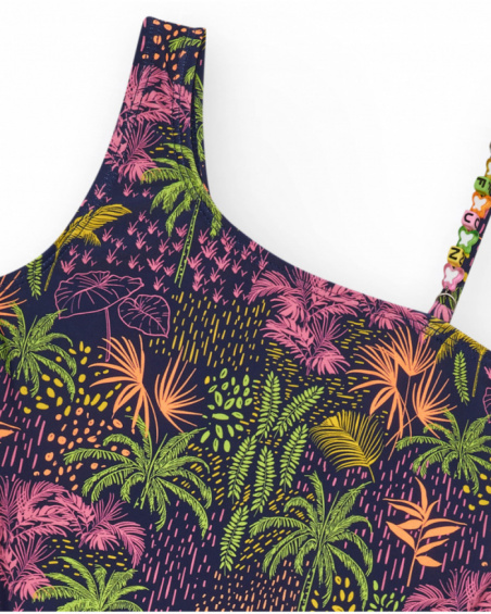 Navy blue girls' swimsuit with an asymmetric design and a tropical print.