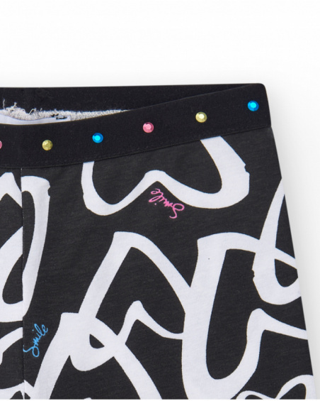 Black cycling leggings for girls with printed hearts and a waistband decorated with studs.