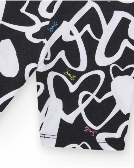 Black cycling leggings for girls with printed hearts and a waistband decorated with studs.